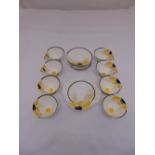 Shelley Art Deco teaset R4756538 to include nine saucers, eight cups and three sandwich plates,