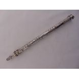 A Victorian silver sealing wax holder, of cylindrical form, chased with flowers and leaves, one