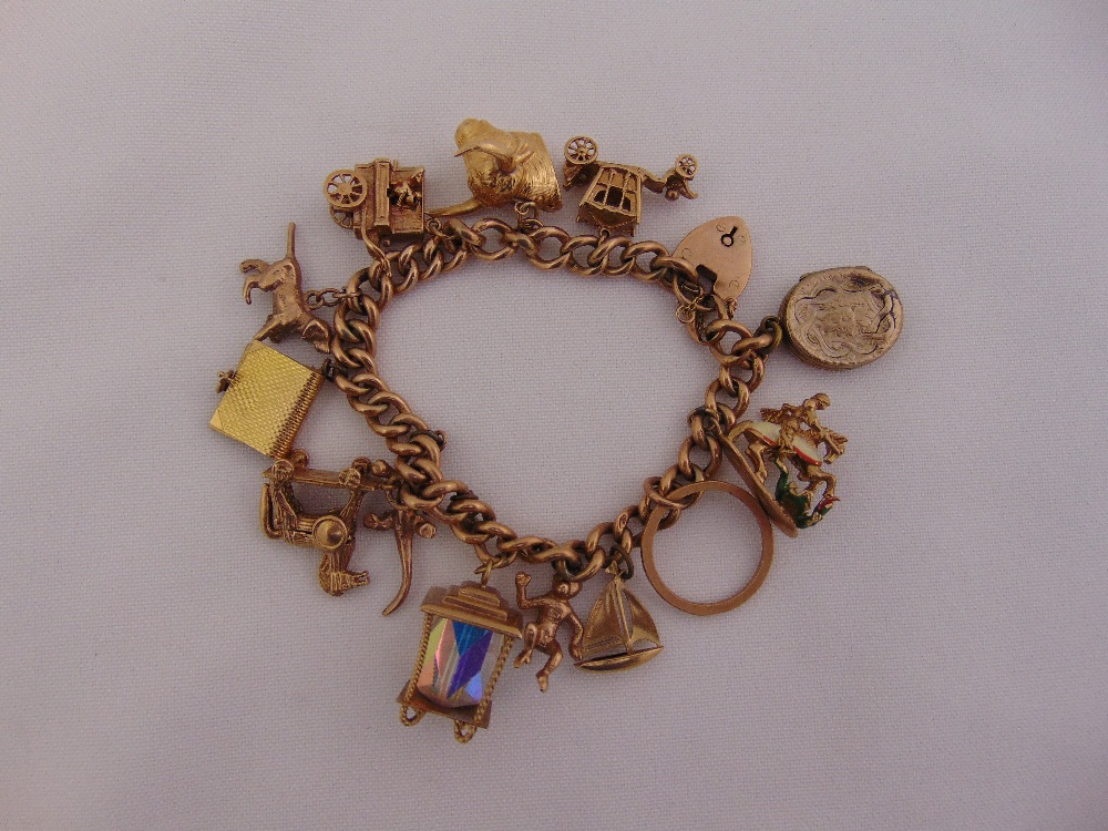 9ct yellow gold charm bracelet with eleven 9ct gold charms and two gold plated charms, approx