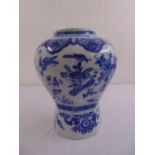 An oriental blue and white baluster vase decorated with birds, flowers and scrolls, marks to the