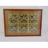 A framed and glazed display of six matching Victorian ceramic tiles, 56.5 x 41cm