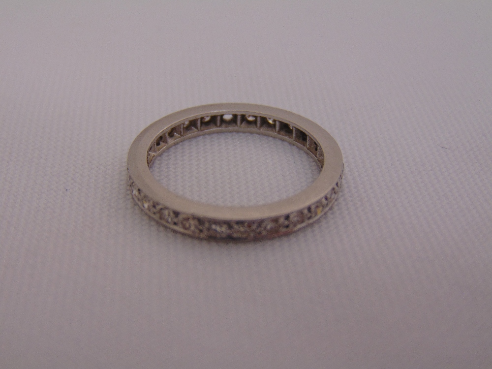 Platinum and diamond eternity ring, approx total weight 4.0g (1 stone missing)