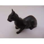A bronze sculpture of a Siamese cat 9cm long, monogram R incised to base
