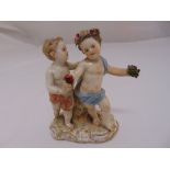Meissen figural group of two putti on naturalistic base, marks to the base, 11.5cm (h) A/F