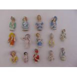 A quantity of German late 19th and early 20th century polychromatic porcelain half dolls (14)