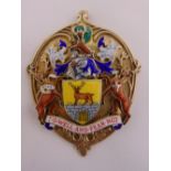 A hallmarked silver gilt and polychromatic enamel Heraldic coat of arms pendant with a motto Do Well