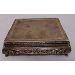 A rectangular silver casket, the ribbed sides with applied floral decoration, gilt wash interior