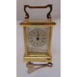 Taylor and Bligh quartz carriage clock of rectangular form, Roman numerals to hallmarked silver dial