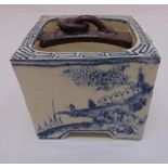 An oriental porcelain jardinière of square section decorated with buildings in a landscape, 11cm (