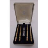 A cased set of hallmarked silver bridge pencils with enamel terminals