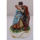 A Capodimonte figural group of a Hussar with his sweetheart on naturalistic base, 28cm (h)