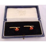 A pair of Cartier 18ct yellow gold, diamond and coral signed cufflinks