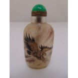 Chinese reverse painted glass snuff bottle decorated with an eagle