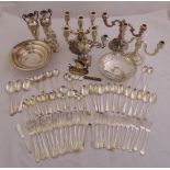 A quantity of silver plate to include candelabras, flatware and a pair of vases