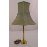 A gilt metal table lamp of tubular form on stepped circular base with shade, 74cm (h)