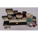 A quantity of costume jewellery to include necklaces, brooches and a pair of gold earrings