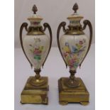 A pair of porcelain and brass garnitures, the ovoid vases painted with birds and floral sprays, 30cm