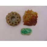 Three jade pendants of varying form and colour