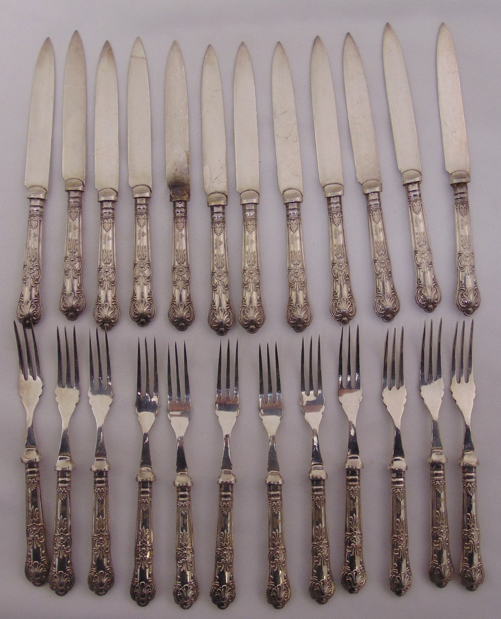 A set of twelve Kings pattern dessert eaters with filled silver handles