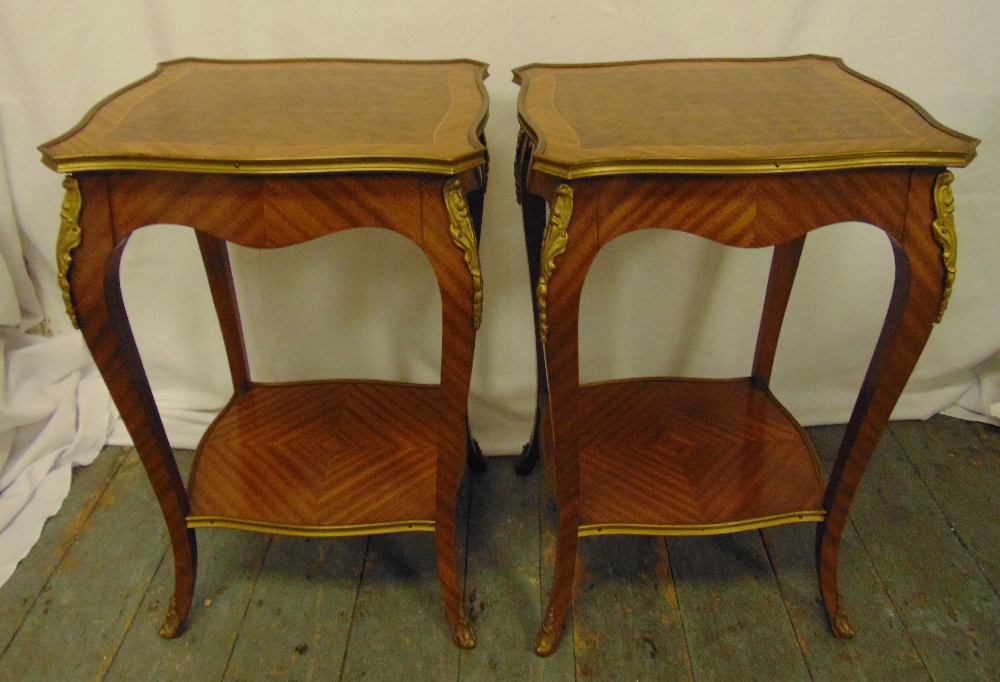 A pair of rectangular kingswood side tables with gilded metal mounts on four cabriole legs, 61.5 x