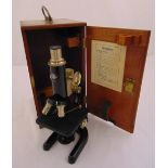 Prior microscope in fitted mahogany case to include two additional lenses