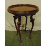A mahogany circular side table on four cabriole legs, 61 x 40cm