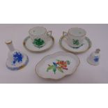 A quantity of Herend to include cups and saucers, a bonbon dish and two table bells (5)