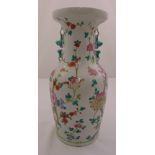 A Chinese baluster vase decorated with flowers and leaves and applied side handles, marks to the