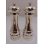 Two silver hallmarked salt and pepper mills of customary form, Birmingham 1969 and London 1993, 15.