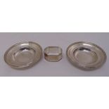 A pair of silver coasters and an engine turned napkin ring, approx total weight 203g