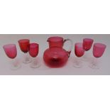Cranberry glass jug and six glasses (7)