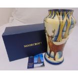 Moorcroft baluster vase decorated with deer in a forest, marks to the base, in original packaging,