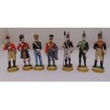 Seven porcelain figurines of military officers in different regimental uniforms, marks to the raised