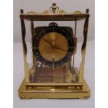 A 1960s Shultz rectangular multi chiming mantle clock with glazed sides on a rectangular base, A/