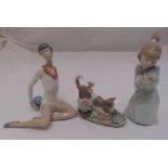 Three Lladro figurines to include a ballerina, a child with a cat and a cat with a frog