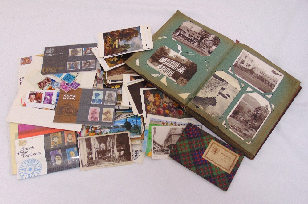 A quantity of vintage postcards to include an album, loose cards and first day covers