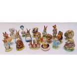 Eighteen Beatrix Potter figurines of various animals