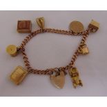 9ct yellow gold charm bracelet to include eight charms and a padlock, approx total weight 29.8g