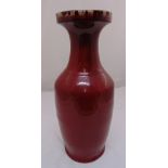 A 19th century oriental ox blood vase of baluster form, 60cm (h)