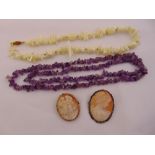 Two cameo brooches, an amethyst necklace and a Mother of Pearl necklace (4)
