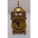 A Smiths brass lantern clock in 17th century style surmounted by bell on four turned peg feet,