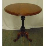 A Victorian circular mahogany tilt top table with knopped baluster stem on three scroll legs, 72.5 x