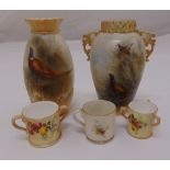 Two Royal Worcester hand painted vases decorated with game birds and three miniature cups, tallest