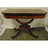 An Edwardian rectangular games table with satinwood inlaid decoration, hinged top on four out