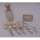 A cut glass perfume bottle with white metal collar and cover, a matching rectangular dish and eleven