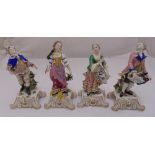 A set of four continental figurines of ladies in classical attire, 26cm (h)