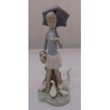 Lladro figurine of a girl holding an umbrella with geese by her feet, marks to the base, 26cm (h)