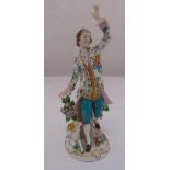 A Chelsea porcelain figurine of a gentleman in 18th century attire with a dog at his heels, 16cm (