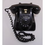 A mid 20th century black telephone
