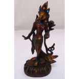 A cast metal figurine of an oriental goddess on a naturalistic oval base, 29cm (h)